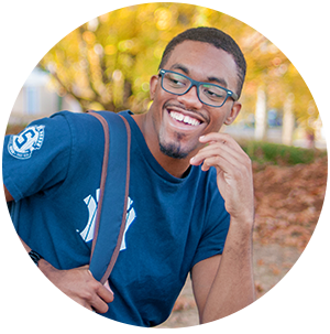 Run Boldly - Photo of Student Smiling on Campus